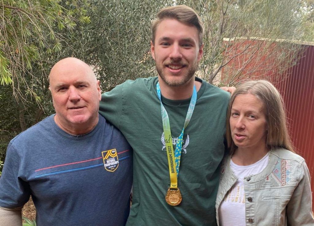 PROUD HOMECOMING: Leigh in Whyalla with parents Rene and Kristen with his gold medal. Picture: Supplied